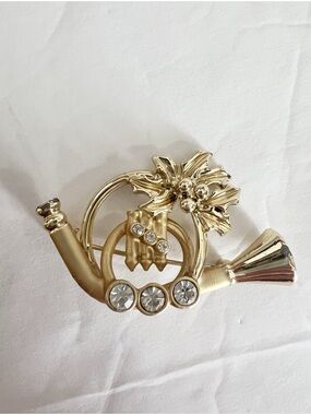 AGC gold horn Christmas pin rhinestone gold tone brooch